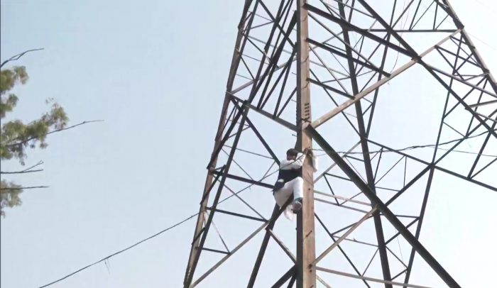 AAP leader Haseeb Hasan climbs transmission tower, alleges party selling tickets for Rs 3 Crores