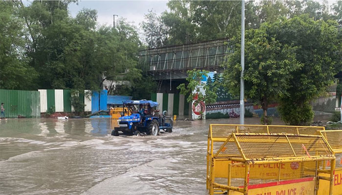 Yamuna flows at a record high level in Delhi as water spills onto the streets of the capital