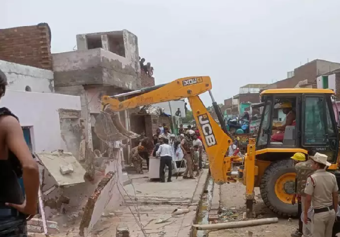 Bulldozers run over illegal encroachment on Railway land near Sri ...